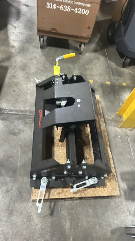 Demco double pivot fifth wheel hitch. Features double pivot head with locking jaw, manual release handle with grip, side mounting latches, and 21K rat