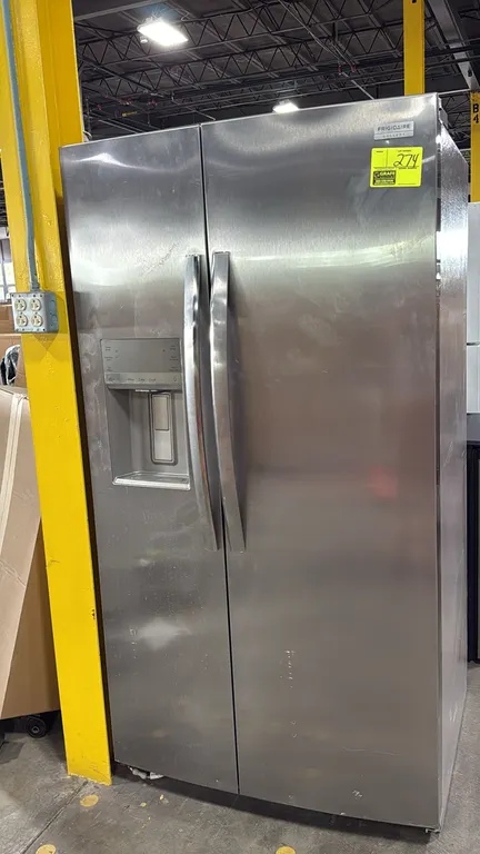 Frigidaire Gallery GRSS2652AFH side-by-side refrigerator freezer. Stainless steel exterior with exterior water and ice dispenser. Interior features ad