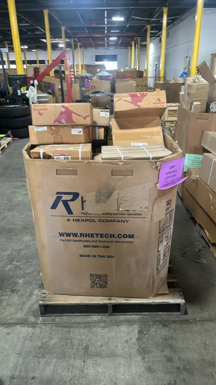 Assorted automotive and heavy-duty truck brake rotors and Gaylord contents. Includes Meritor Genuine air disc brake rotor (P/N: 23 123527 002), Ford M