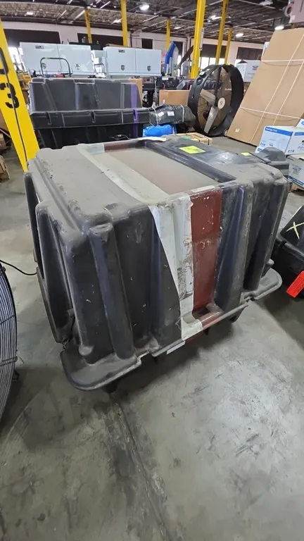 Poly transport engine box. Features molded polyethylene construction, hinged top lid, exterior latches, and an interior molded component cradle. Appro