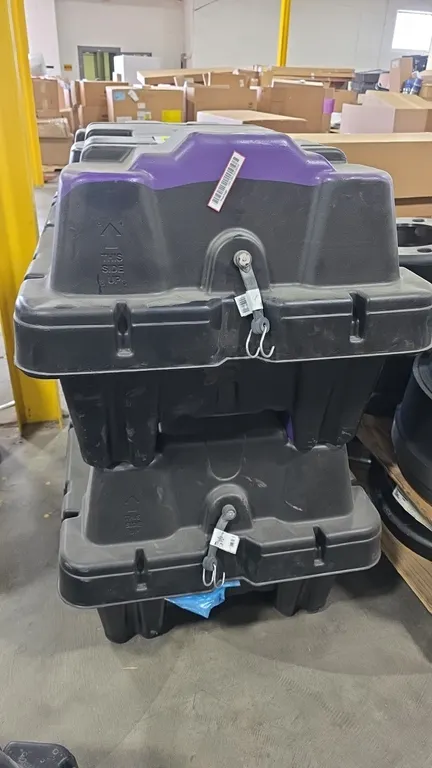 Ford 10R60/80 poly transmission transport cases. Features molded polyethylene construction, hinged lids, latching hardware, and internal support dunna