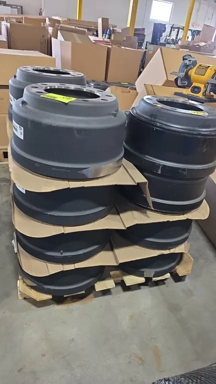 Assorted heavy-duty cast iron outboard-mounted brake drums. Includes Alliance Truck Parts ABP N42A1657B, Motorcraft BRDF-23, and part 10033071. Featur