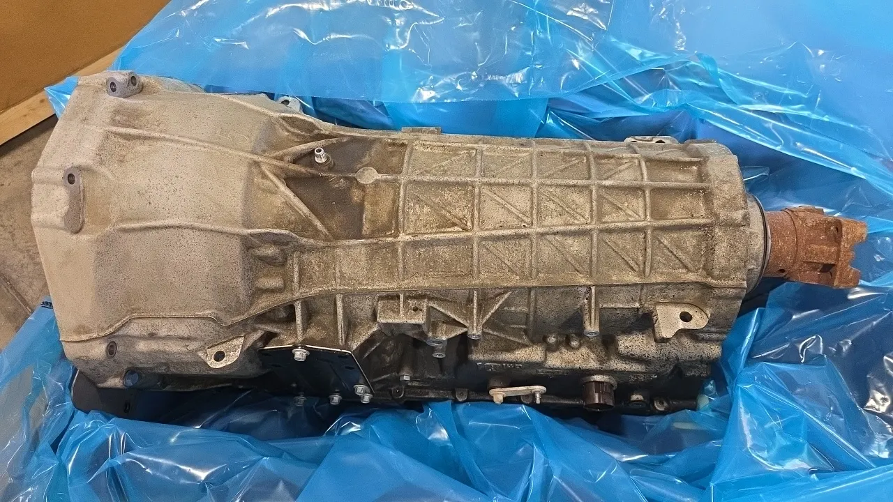 Ford automatic transmission core. Features torque converter, rear slip yoke, and PTO provision. Labeled Gas 4x2, part number LC3P 7000 BB. Includes mo