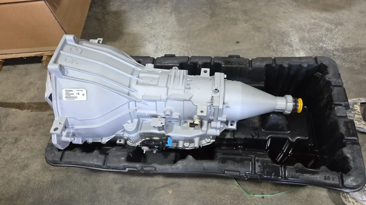 Ford AC2Z-7000-DARM remanufactured automatic transmission. Features included torque converter with bellhousing retainer bracket, range switch, and pro