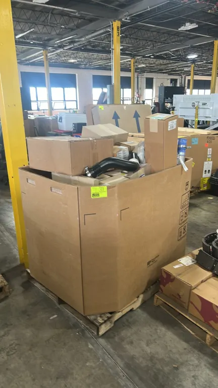 Gaylord lot of Ford OEM automotive parts. Includes genuine Ford engine oil cooler assemblies (P/N: 9C2Z-6A642-A), oil pan assembly (P/N: 4C3Z-6675-AA)