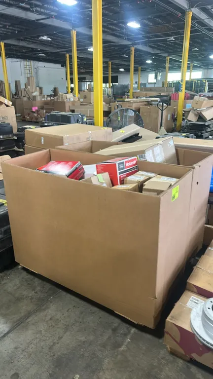 Gaylord container of genuine Ford and Motorcraft automotive parts and remaining contents. Includes Ford drive shaft center support bearings (P/N: F81Z