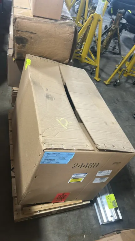 Ford LK4Z-7000-DA automatic transmission assembly. Genuine Ford Parts replacement component. Housed in original factory packaging on a wooden pallet b