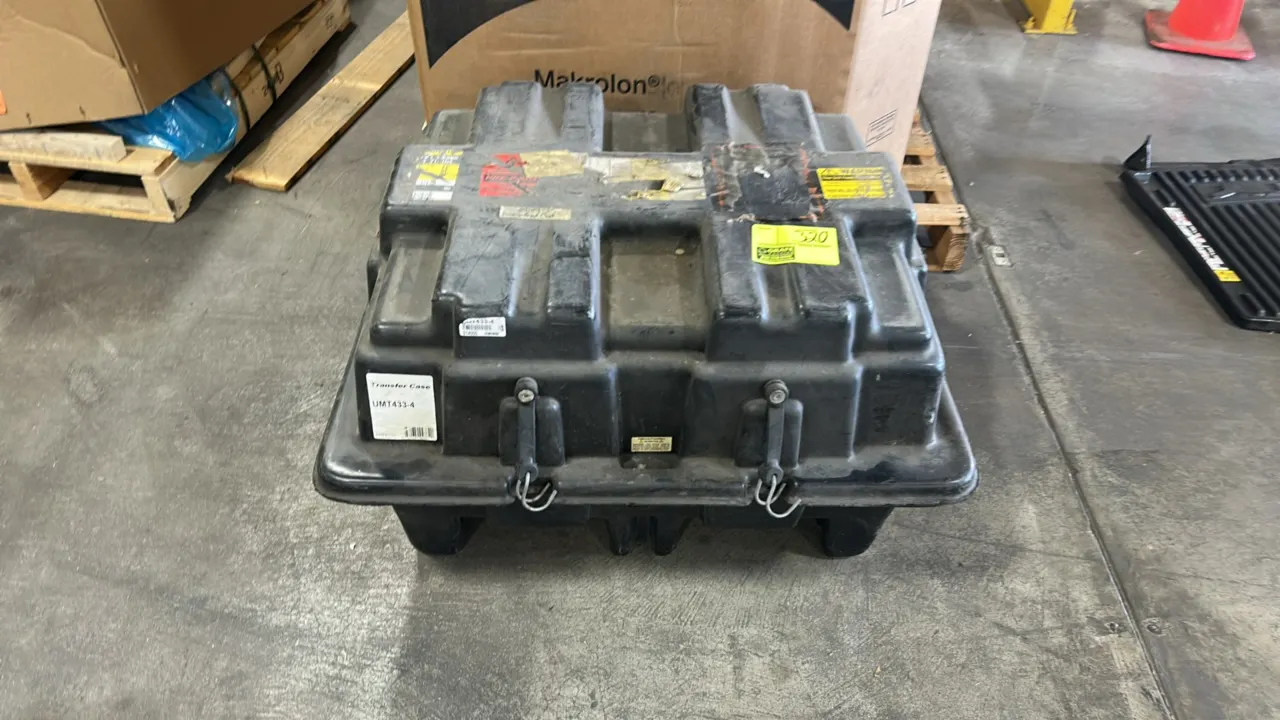 Polyethylene transfer case shipping container, part number UMT433-4. Features heavy-duty molded plastic construction, latching lid, and integrated mol