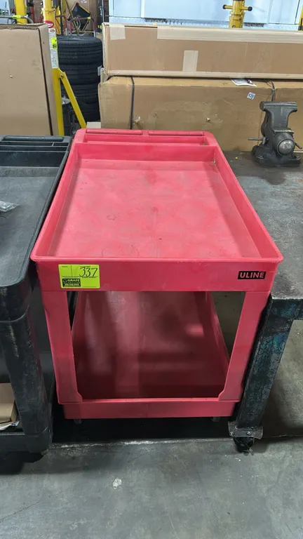 Uline poly 2-tier utility cart. Features red molded plastic construction, deep-lipped shelves, and integrated push handle with storage compartments. 4