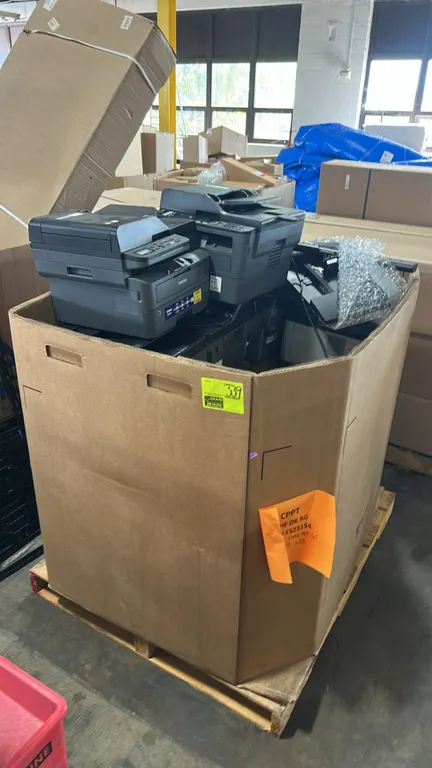 Package lot of office electronics in Gaylord container. Includes multiple Brother DCP-L2640DW monochrome laser multi-function printers, Dell monitors,