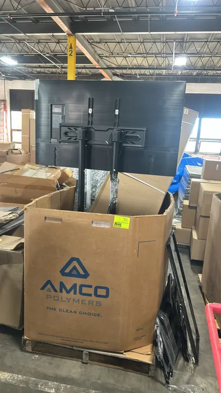 2023 Samsung UN50CU8000F 50" Crystal UHD 4K Smart TV package lot. Includes 50" TV mounted to dual-pole stand, additional TV mounting brackets, and ass