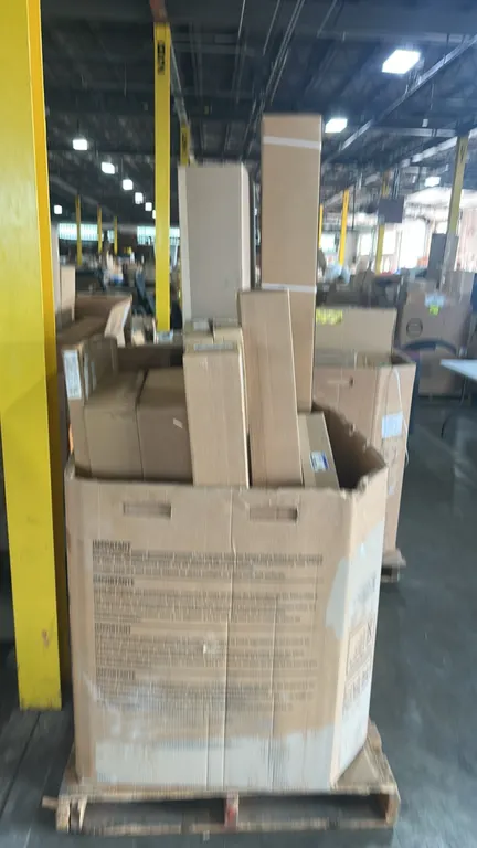 Assorted automotive and truck parts in Gaylord container. Includes Ford radiator grille molding (P/N: MB5Z-8200-KAPTM), Ford OEM surround weatherstrip