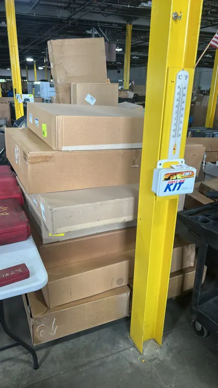 Assorted genuine Ford and Motorcraft automotive cooling parts and pallet contents. Includes Ford radiator fan shroud (P/N: 3C3Z-8146-AJ), Motorcraft r