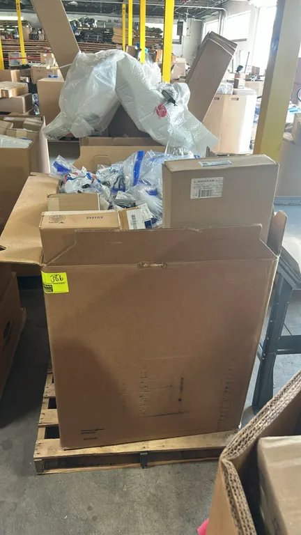 Ford automotive parts lot in Gaylord container. Includes console armrest assemblies (P/N GB5Z-7806024-AC), Air Design door molding kit (P/N VLV4Z-1820