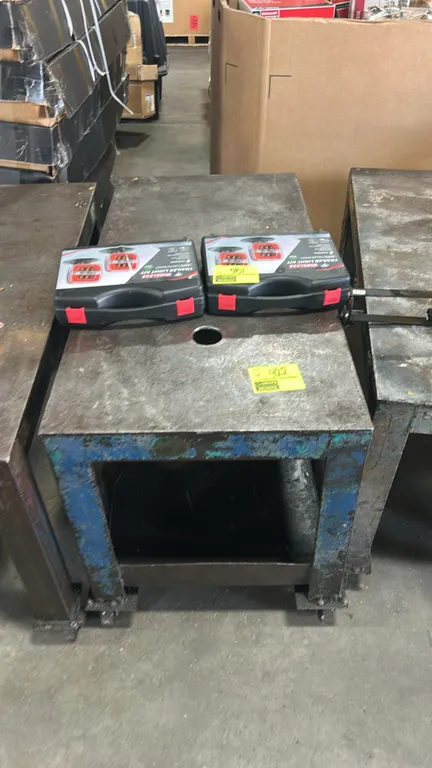 Metal 2-tier carts. Features welded steel construction, lower shelf, and top surface opening. 4' x 2'. Mounted on casters. Cases shown on top not incl