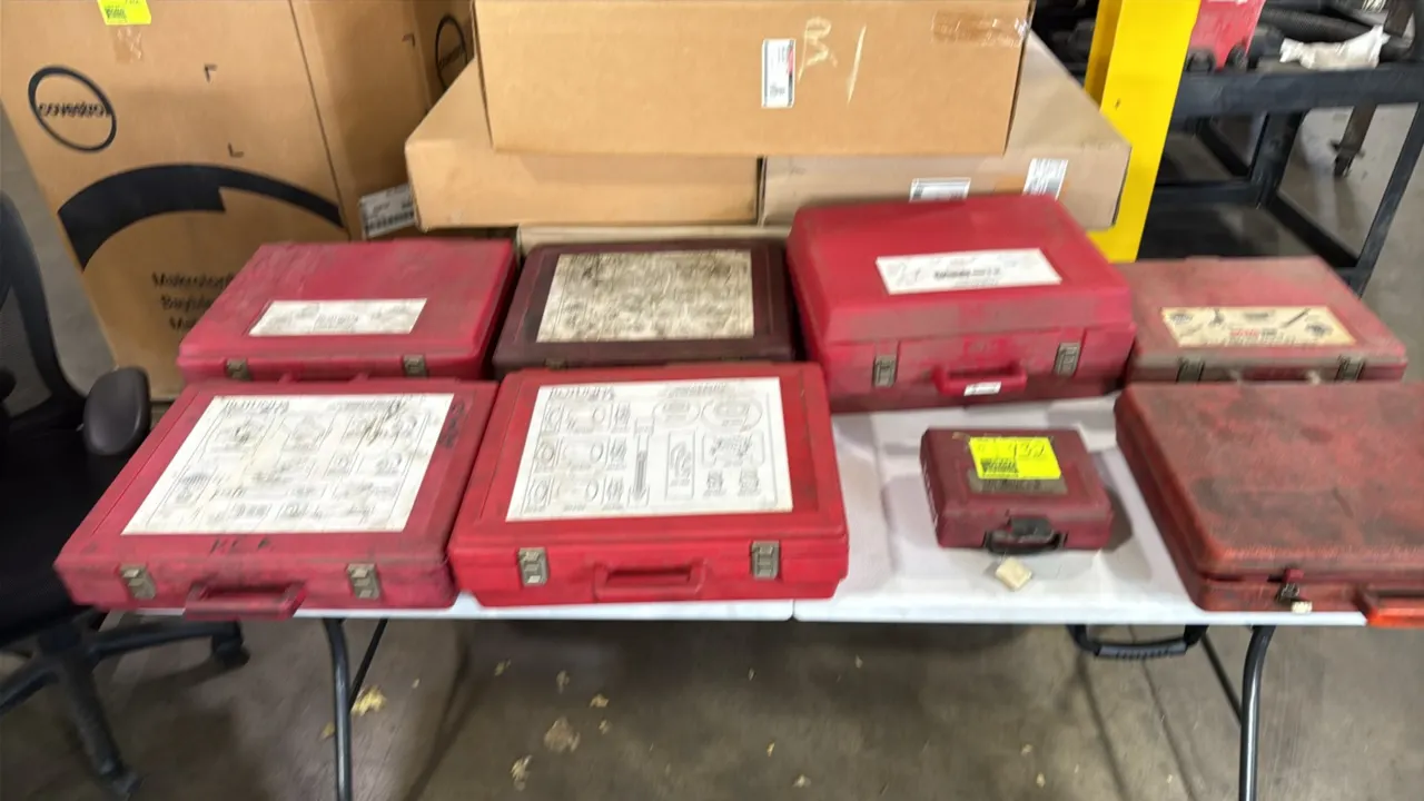 Ford Rotunda essential special service tool sets. Assorted automotive diagnostic, installer, and remover sets housed in molded red plastic cases with