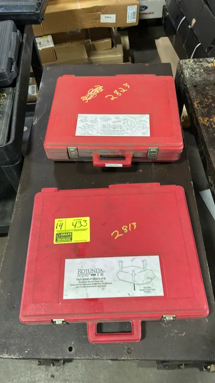 Ford Rotunda essential special service tool sets. Assorted automotive specialty service and alignment tools housed in red molded plastic hard cases. I