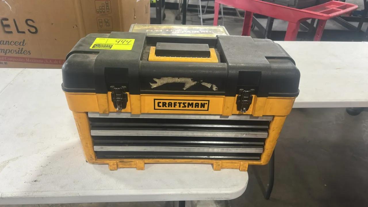 Craftsman 3-drawer portable tool box. Features a top storage compartment, 3 slide-out drawers, dual metal latches, and an integrated top carry handle.