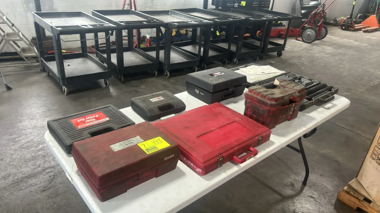 Assorted automotive specialty service tool sets. Includes Kent-Moore air disc brake service tool kit, Pittsburgh gear puller set, Spotnails pneumatic