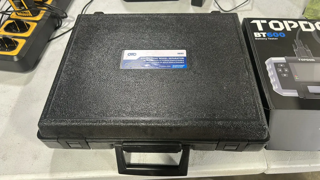 Automotive tool lot. Includes Ford Rotunda NAIAT-R5903 wire splice tool kit with hard case, OTC 5693 single/dual wheel separator kit with molded case,