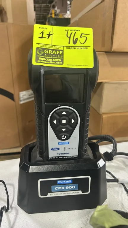 Midtronics Rotunda CPX-900 battery and electrical system analyzer. Features Ford/Lincoln dealer branding, digital display, navigation keypad, and inte