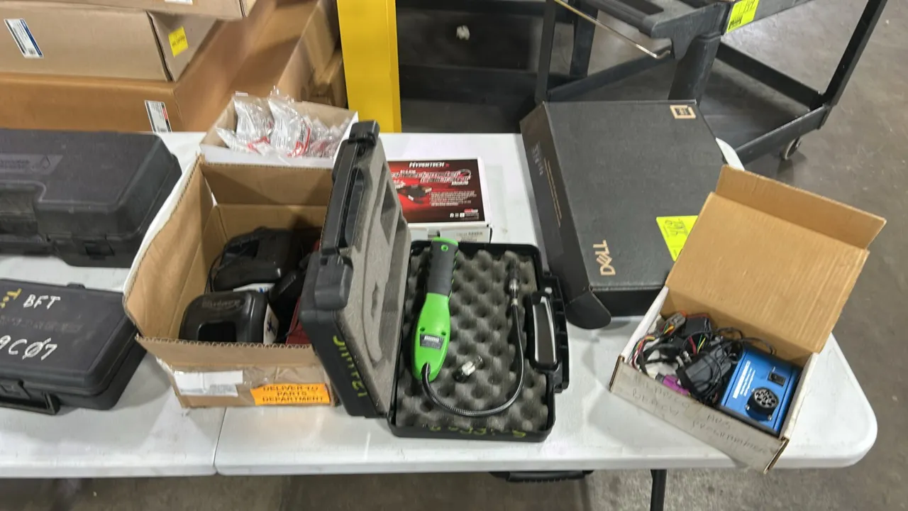 Automotive shop and diagnostic equipment lot. Includes Uline safety glasses, Rotary charging stations, Hypertech in-line speedometer calibrator module