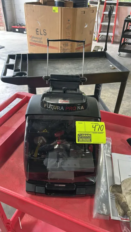 Ilco Silca Futura Pro NA electronic automated key cutting machine and duplicator. Features capability for laser-cut and flat keys, protective safety s