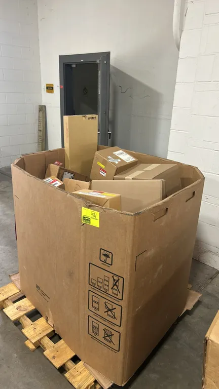 Assorted automotive parts lot in Gaylord container. Includes genuine Honda left rear outer seat belt set (P/N: 04828-SCV-A01ZB), HVAC blower motor ass