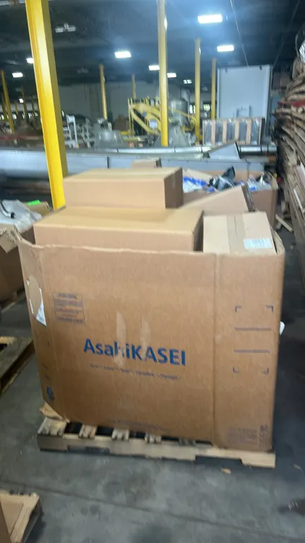 Ford OEM auto parts lot in Gaylord container. Includes genuine Ford and Motorcraft parts: fender molding (P/N: CK4Z-16003-CA), front right lower bumpe