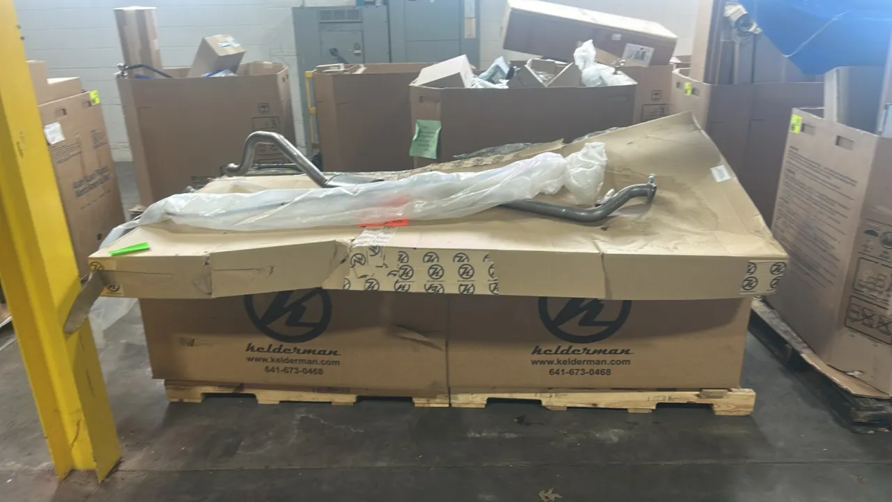 Pallet lot of automotive parts. Includes genuine Ford OEM rear muffler exhaust assembly (P/N: GN15-5K254-HD), RIGID Industries Midnight Edition E-Seri