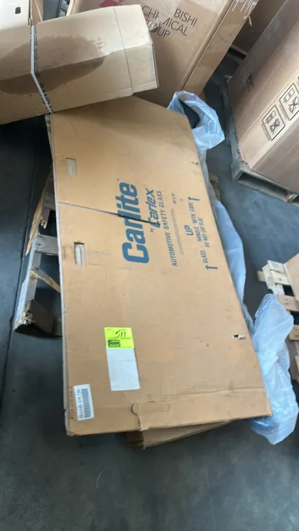 Ford automotive parts lot. Includes genuine Ford front right (passenger side) fender assembly (part number HS7Z-16005-A), Carlite Carlex automotive re