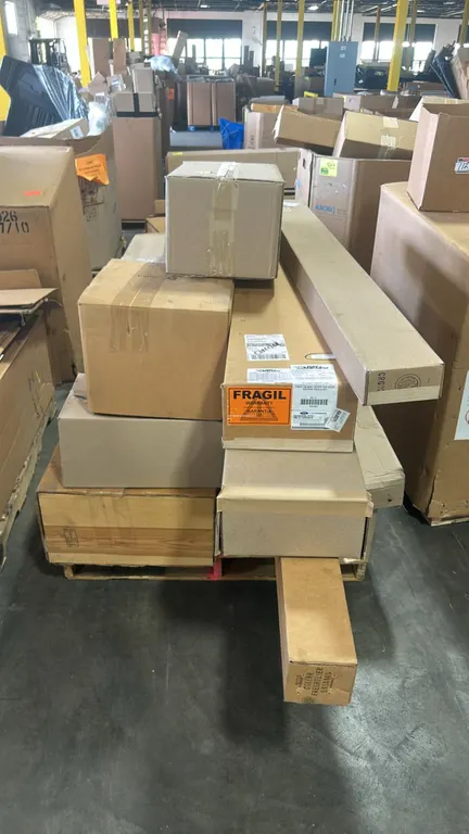 Pallet of Ford OEM automotive parts and assorted contents. Includes shaft and gear assembly (P/N: PC3Z-7060-C), convertible top seal moulding (P/N: AR