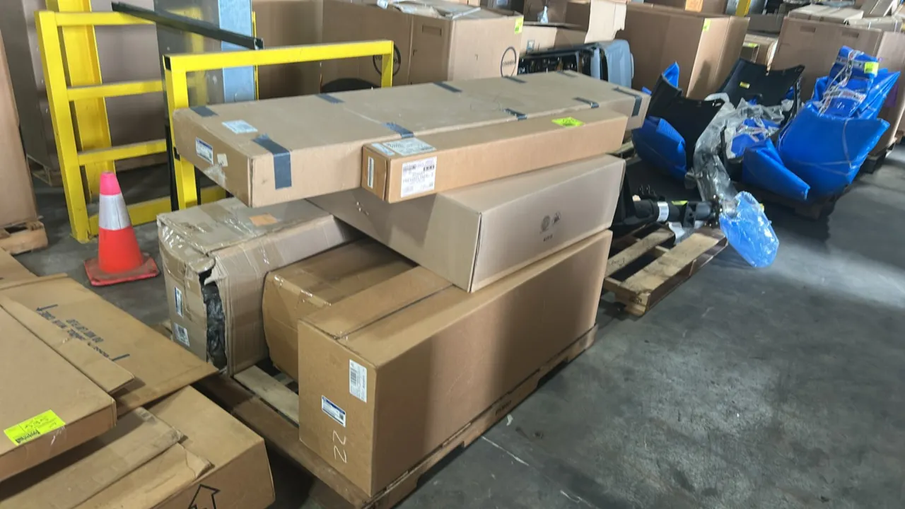 Pallet lot of genuine Ford OEM automotive parts. Includes valance panel (P/N: JL3Z 17626 AC), front upper radiator shutter assembly (P/N: ML3Z-8475-D)