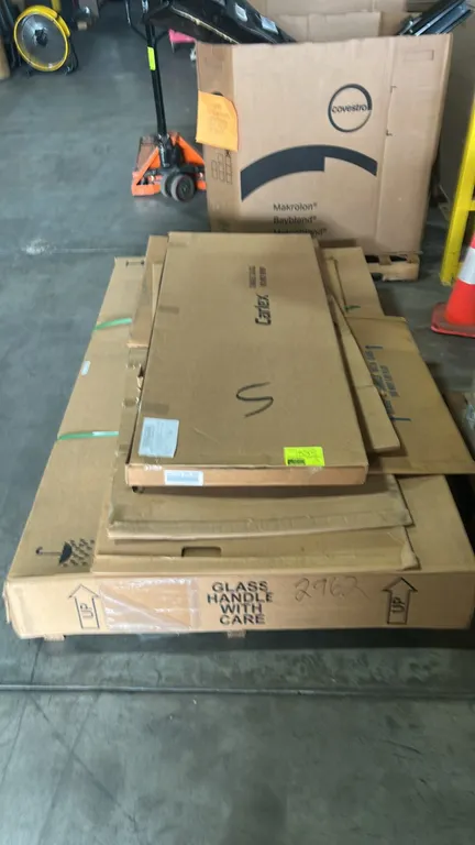Ford automotive replacement glass lot. Includes Carlex side window glass for Ford Transit low-roof (part DD12323 YPYCAR) and genuine Ford windscreen g