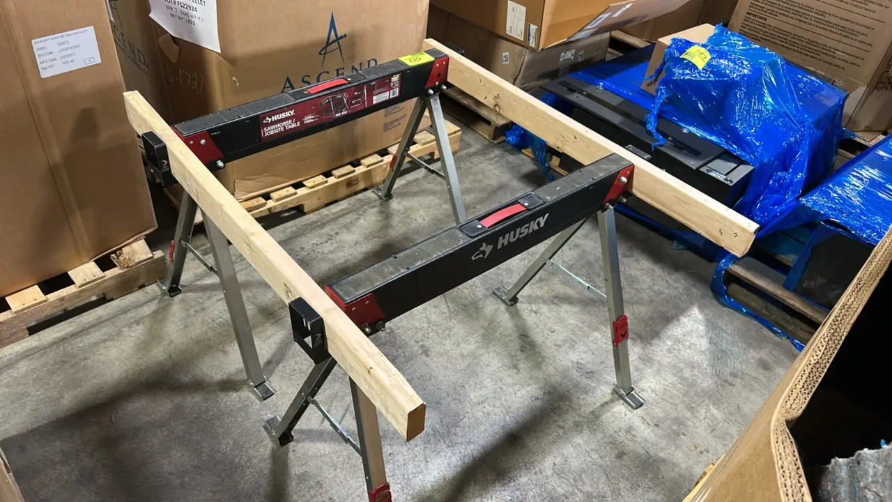 Husky steel sawhorse and jobsite table. Features folding legs, built-in carrying handle, 2x4 support brackets, and durable steel construction. Rated a