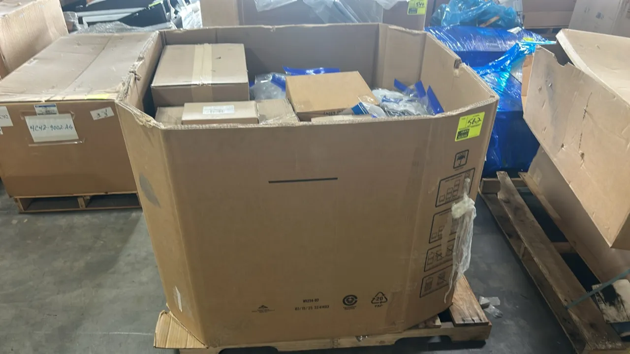 Ford OEM automotive parts package lot in bulk Gaylord container. Includes outer rear-view mirror glass assemblies (P/N: CT4Z-17K707-A, FC4Z 17K707 C),