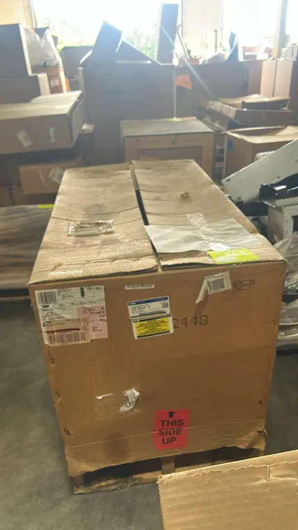 Ford LC3Z-7000-DB automatic transmission assembly. Packaged in manufacturer cardboard shipping crate mounted on a wooden pallet.