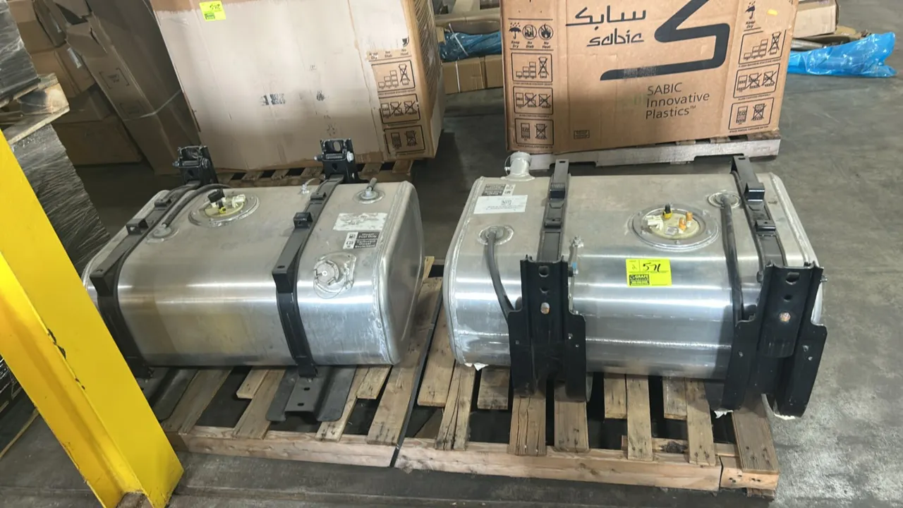 Ford aluminum semi-truck diesel fuel tanks. Features aluminum construction, mounting brackets with straps, fuel caps, and integrated sending unit asse