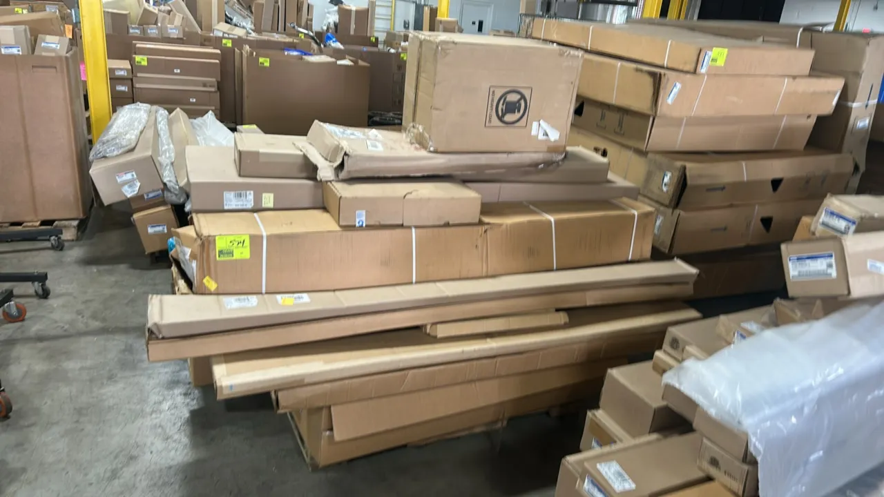 Pallet lot of genuine OEM Ford automotive parts. Includes front lower bumper valance panel assembly (P/N: HL3Z-17626-BB), truck bed upper molding (P/N