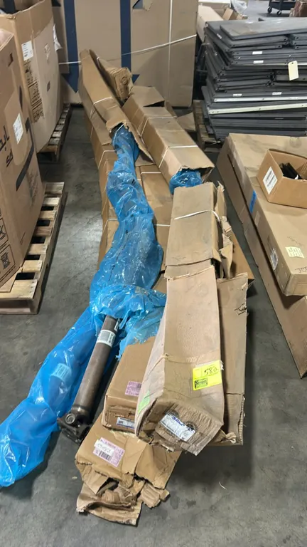 Ford CK4Z-4R602-CS drive shaft assemblies. Features universal joints and factory packaging. Note: Packaging is open and damaged.