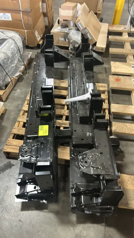 Ford PK4Z-6120040-B step assembly. Features heavy-gauge stamped steel construction with a black protective finish and integrated mounting brackets. OE