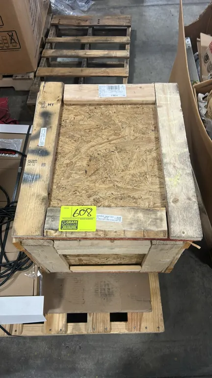 Ford rear axle differential carrier assembly. Part number: S 608 D. Housed in a wooden shipping crate with protective plastic wrapping.