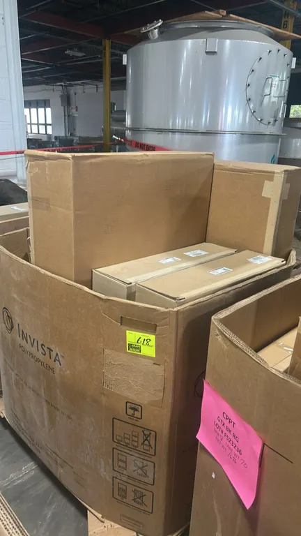 Assortment of Ford Motorcraft automotive cooling assemblies and parts in a Gaylord container. Includes radiator assembly (P/N: LK4Z-8005-J), engine co