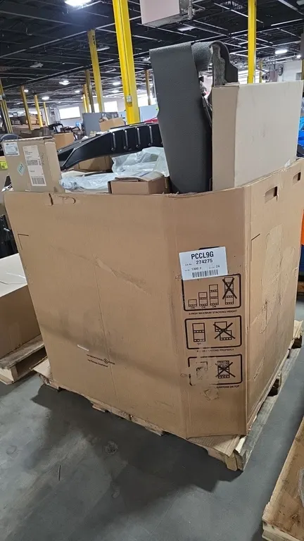 Quantity of assorted Ford OEM automotive parts and accessories housed in a gaylord box. Includes sheet metal body panel (JR3Z-6340320-C), deflector ki