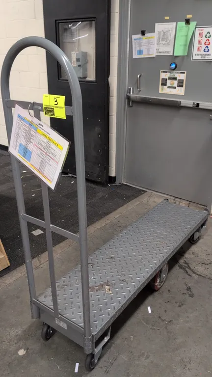 Metal 6-wheel U-boat stocking cart. Features diamond plate steel deck, single tubular steel handle, and corner handle sockets on both ends. 5'L. Mount