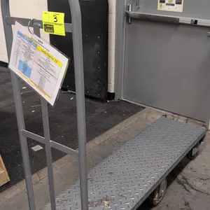 Metal 6-wheel U-boat stocking cart. Features diamond plate steel deck, single tubular steel handle, and corner handle sockets on both ends. 5'L. Mount