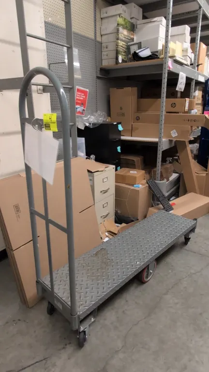 Metal 6-wheel U-boat platform cart. Features steel diamond tread plate deck and single tall removable tubular end handle. 5'L. Mounted on 6 wheels wit