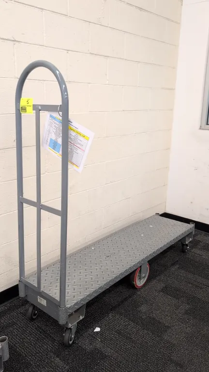 Metal 6-wheel U-boat platform cart. Features diamond plate steel deck and single removable tubular end handle. 5'L. Mounted on (2) rigid center wheels