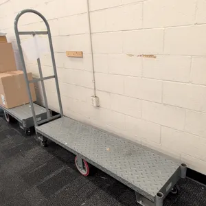 Metal 6-wheel U-boat cart. Features diamond plate steel deck and single removable tubular steel end handle. 5'L. Mounted on (2) rigid center wheels an