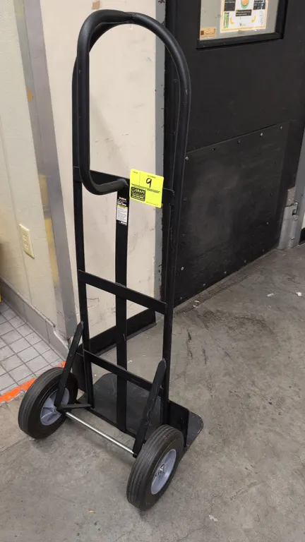 Franklin hand truck. Features a tubular steel frame with loop handle, solid toe plate, and 800 lb capacity. Mounted on (2) solid rubber tires. S/N: 37